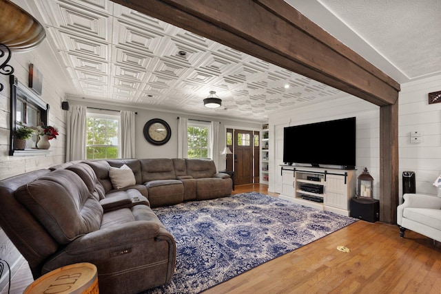 living room featuring wood-type flooring and a wealth of natural light