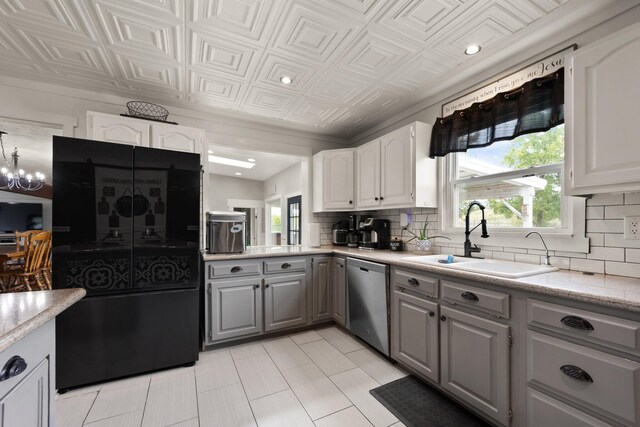 kitchen with gray cabinets, a notable chandelier, white cabinetry, dishwasher, and sink