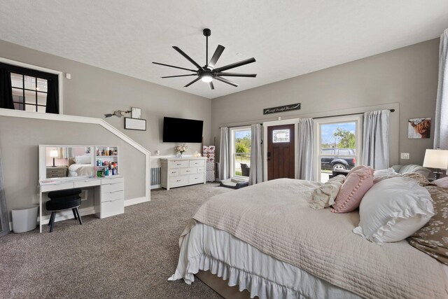 carpeted bedroom with ceiling fan and multiple windows