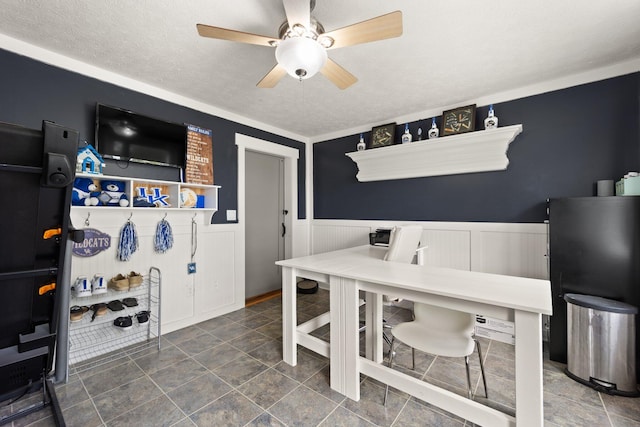 office area featuring a textured ceiling and ceiling fan