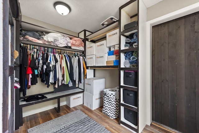 walk in closet featuring hardwood / wood-style floors