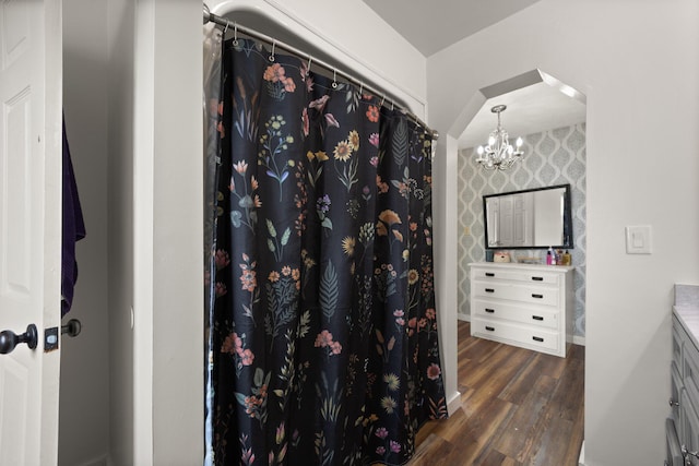 bathroom featuring vanity, a chandelier, and hardwood / wood-style flooring