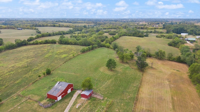 birds eye view of property with a rural view