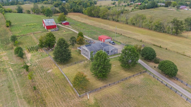 birds eye view of property with a rural view