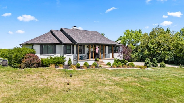 view of front of house with a porch and a front lawn