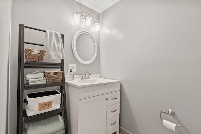 bathroom with vanity and a textured ceiling