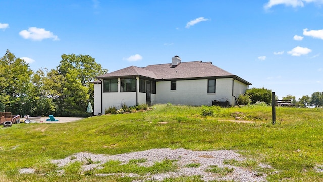 rear view of house with a sunroom