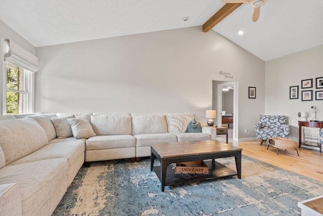 living room with hardwood / wood-style floors, lofted ceiling with beams, and ceiling fan