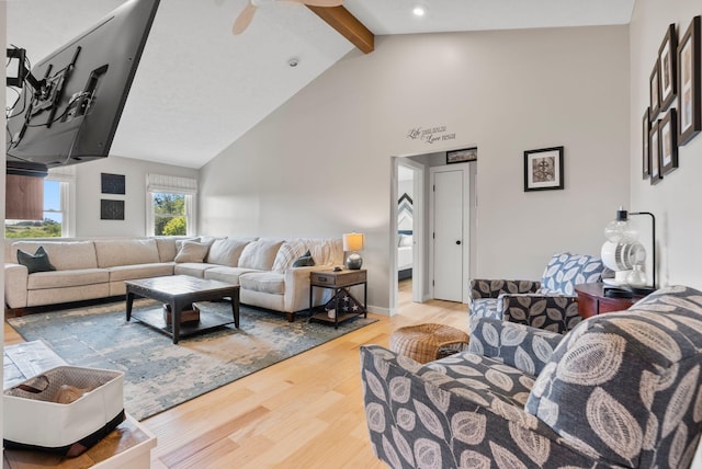 living room with high vaulted ceiling, wood-type flooring, and beamed ceiling