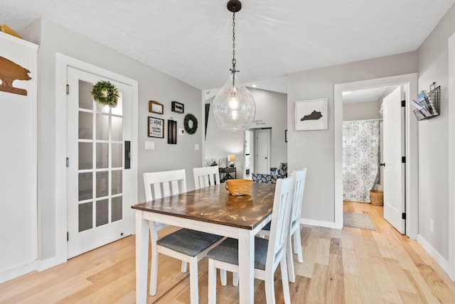 dining area with light hardwood / wood-style floors