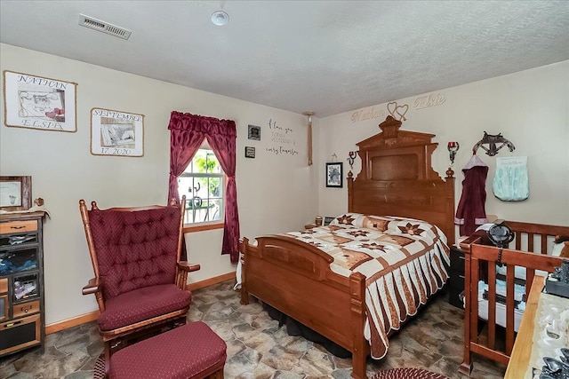 bedroom featuring a textured ceiling