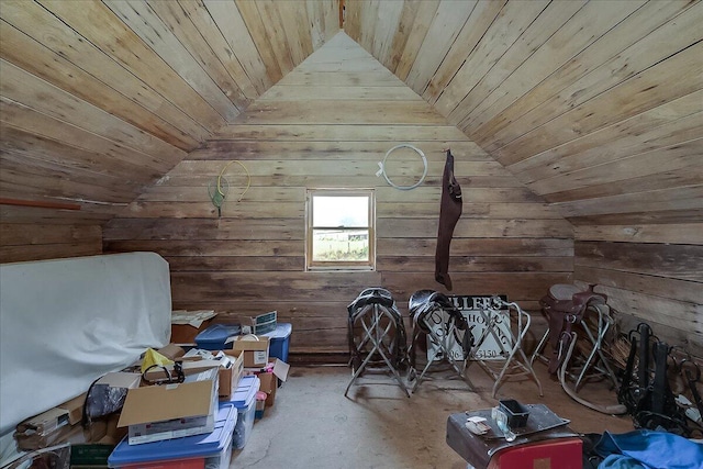 interior space with wood ceiling, wooden walls, and vaulted ceiling