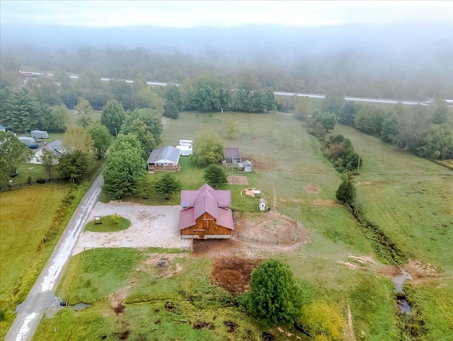 birds eye view of property with a rural view