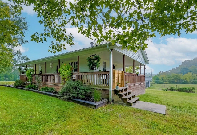 exterior space featuring a yard and covered porch