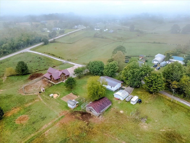 birds eye view of property with a rural view