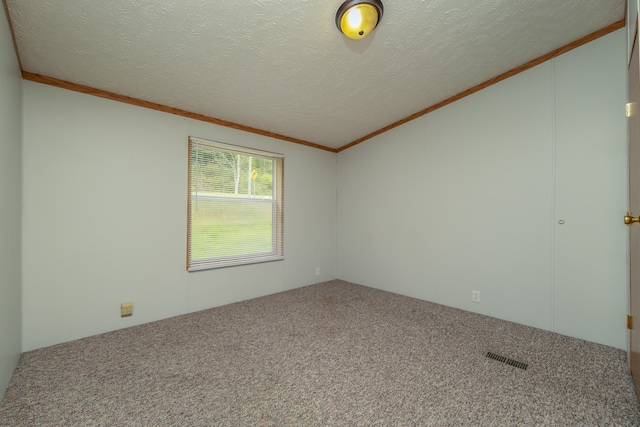 unfurnished room with a textured ceiling, carpet flooring, and ornamental molding