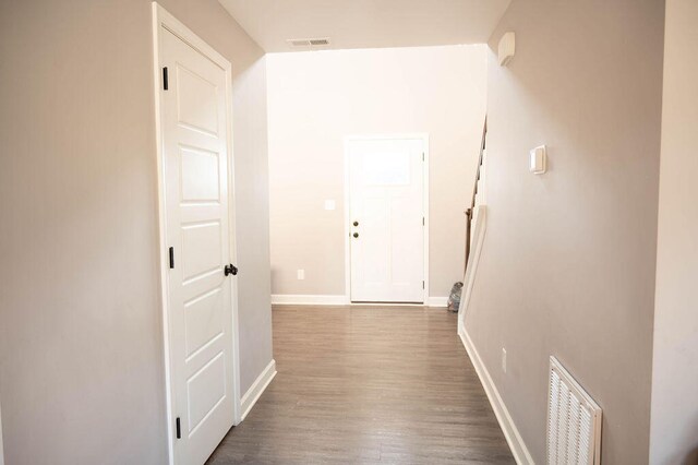 corridor with dark wood-type flooring