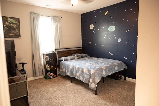 bedroom with ceiling fan and carpet floors