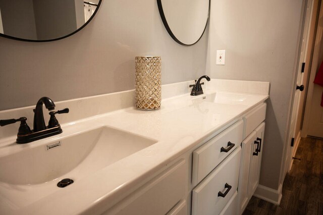 bathroom featuring vanity and hardwood / wood-style flooring