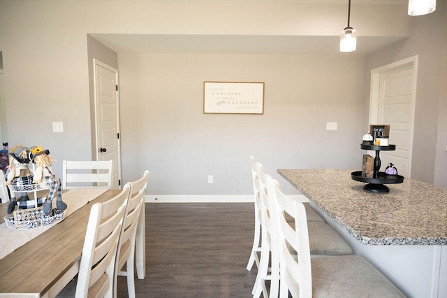 dining space with dark wood-type flooring