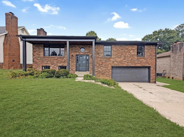 split foyer home featuring a front yard and a garage