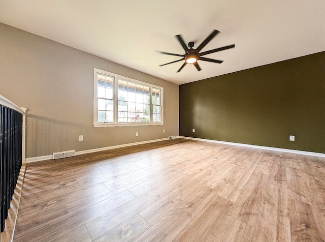 unfurnished living room featuring ceiling fan and light hardwood / wood-style floors