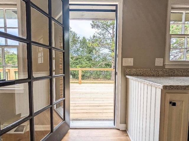 doorway featuring wood-type flooring