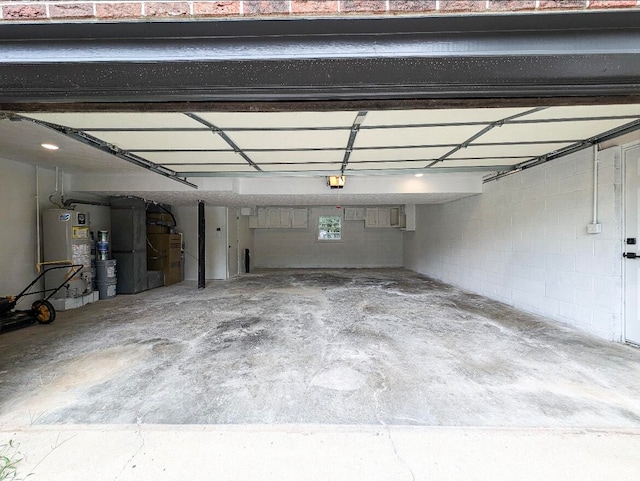 garage featuring water heater and a garage door opener