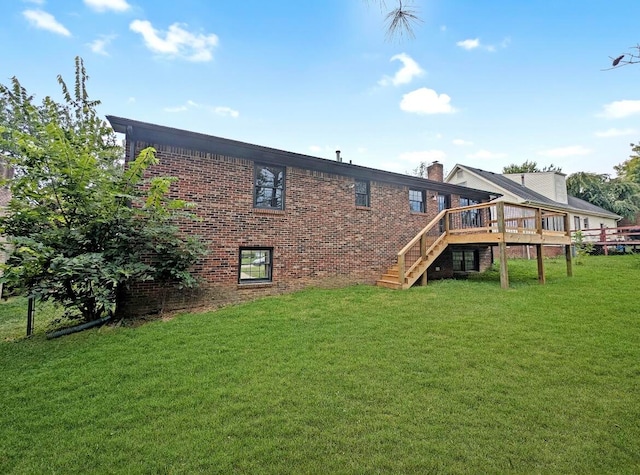 back of house with a yard and a deck