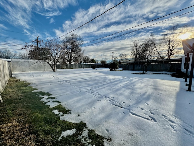 view of yard layered in snow