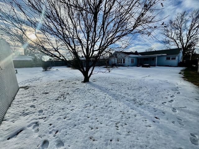 view of yard layered in snow