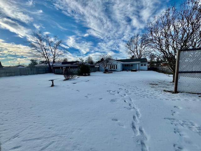 view of yard covered in snow