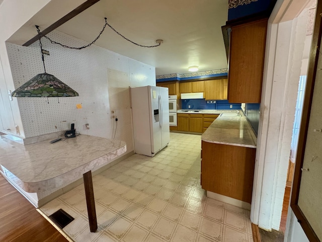 kitchen with sink and white appliances