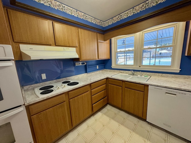 kitchen with white appliances and sink