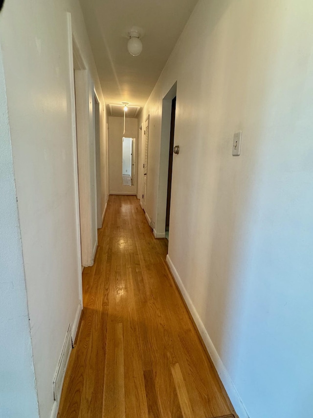 hallway featuring light hardwood / wood-style flooring