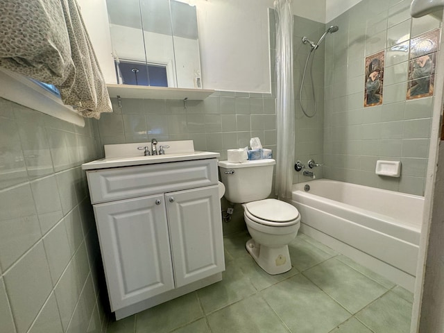 full bathroom featuring tile patterned floors, toilet, tile walls, vanity, and shower / bath combination with curtain