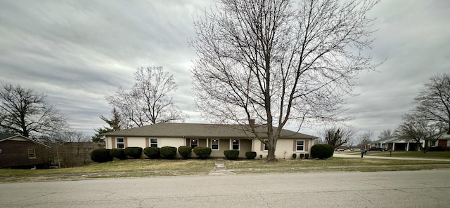 ranch-style home with stucco siding