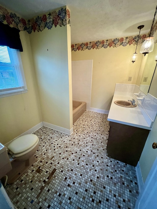 full bathroom with tile patterned flooring, toilet, vanity, and baseboards