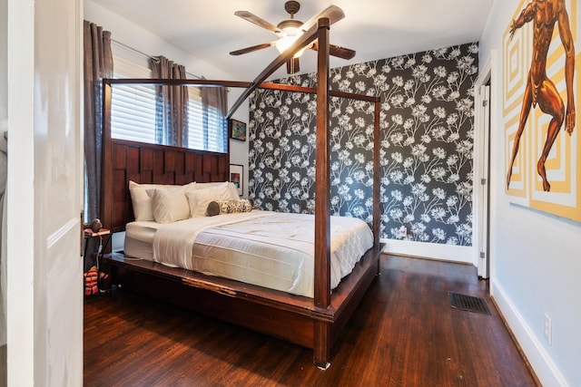 bedroom with ceiling fan and dark hardwood / wood-style floors