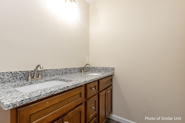 313 Baughman Ave Unit 25, Danville, KY 40422 - bathroom featuring double vanity, a sink, and baseboards