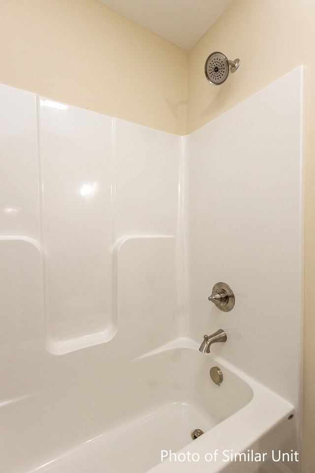 bathroom with shower / tub combination