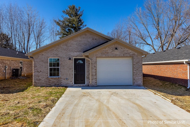 single story home with a front lawn, central AC unit, and a garage