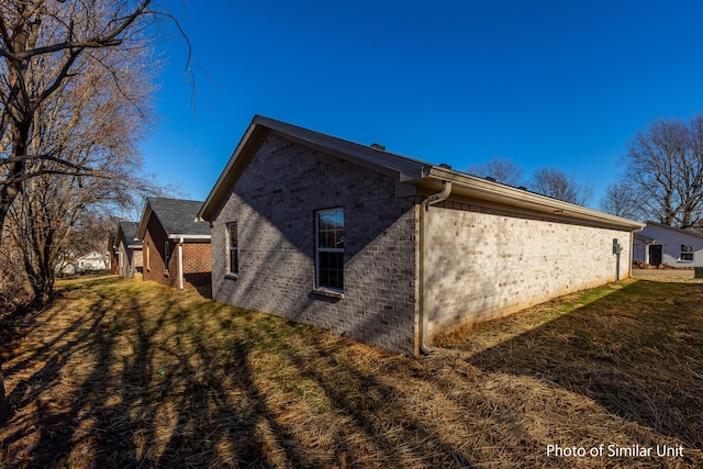 view of property exterior featuring a yard