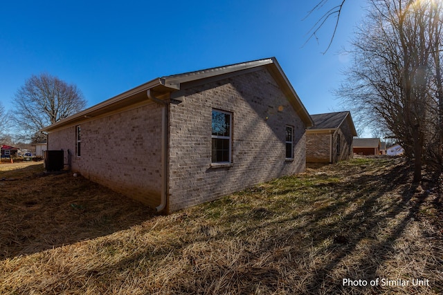 313 Baughman Ave Unit 25, Danville, KY 40422 - view of side of property featuring central air condition unit and brick siding