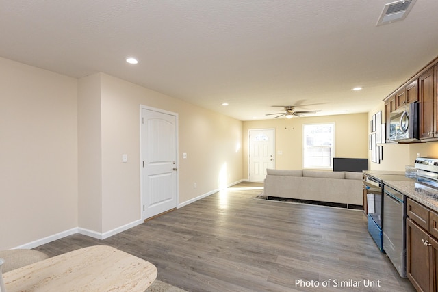 313 Baughman Ave Unit 25, Danville, KY 40422 - kitchen featuring electric stove, wood finished floors, stainless steel microwave, visible vents, and open floor plan