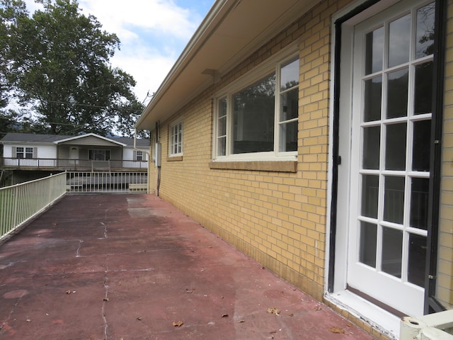 view of home's exterior with brick siding