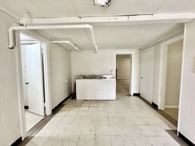 interior space with light floors and baseboards