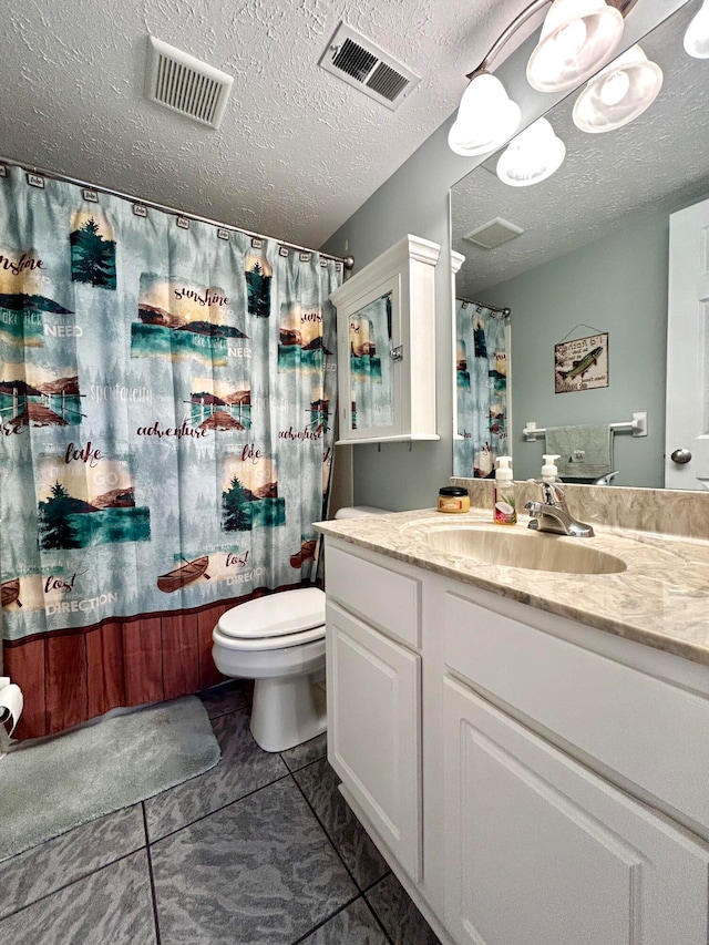 full bathroom featuring shower / tub combo, toilet, tile patterned floors, vanity, and a textured ceiling