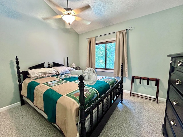 bedroom featuring ceiling fan, a textured ceiling, and light carpet