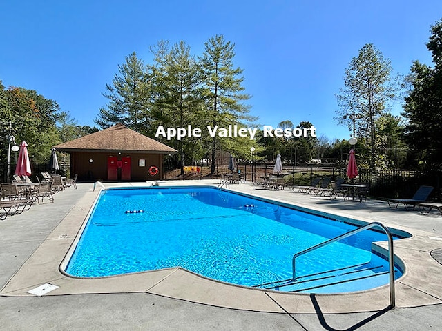 view of swimming pool with a patio area